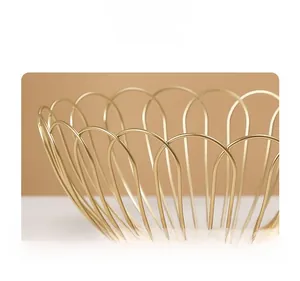 Close-up of golden iron fruit basket showing elegant petal wire design and metallic finish