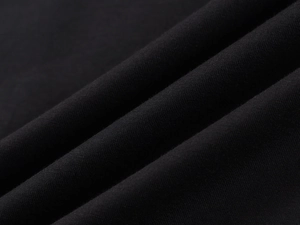 Close-up of premium black diagonal twill fabric texture and soft woven material