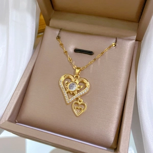 Double-layered gold titanium steel necklace with heart zircon pendants in a gift box