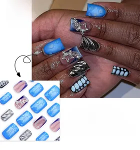 Macro detail of 3D ocean blue press-on nails with silver relief and starry glitter patterns