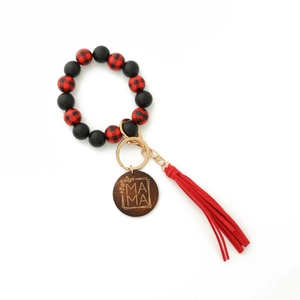 Detail of red black plaid wooden bead bracelet keychain with tassel and MAMA engraved disc