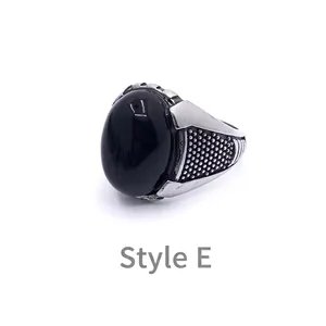Detail view of Style E vintage men's ring with black oval gemstone and silver band
