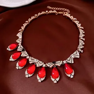Vintage gold necklace set with red teardrop pendants and crystal pavé fan links