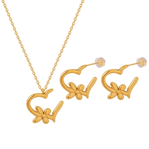 Elegant gold flower and heart jewelry set featuring a necklace and matching earrings