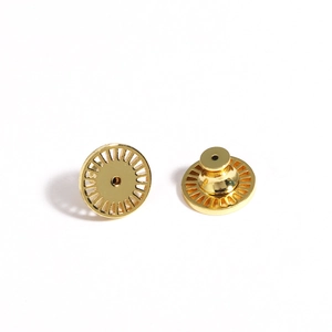 Macro view of gold-plated earring lifter backs with secure disc support for studs