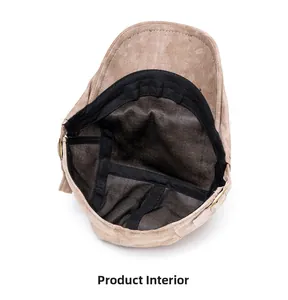 Detailed interior view of a washed khaki newsboy cap featuring black lining and sweatband