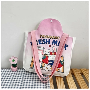 Detail of pink gradient canvas tote bag with cute rabbit and strawberry milk print