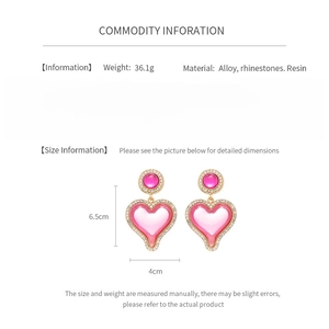 Detailed spec sheet showing pink resin heart earrings size 6.5cm with rhinestone alloy trim