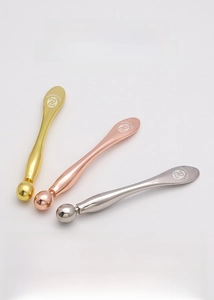Zinc alloy eye cream applicators in gold, rose gold and silver with massage roller balls