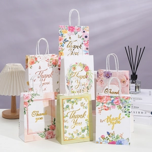 Floral kraft paper gift bags with gold foil Thank You print and white handles