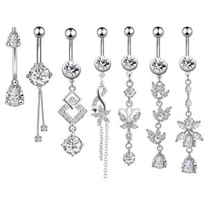 7-piece silver belly button ring set with zircon teardrop and flower tassel designs