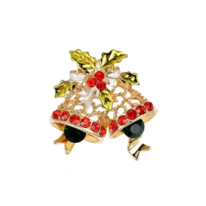 Detail of Christmas bell brooch featuring red and green enamel with sparkling rhinestones