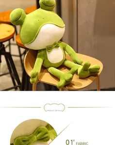 Detail view showing the soft texture and green bowtie of this cute frog plush toy.
