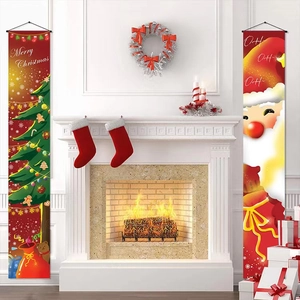 Merry Christmas banner set with Santa and trees hung symmetrically by a cozy white fireplace