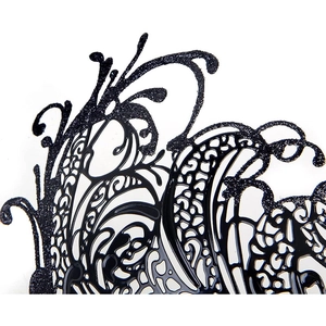 Close-up of black hollow masquerade mask with glitter details for festival parties