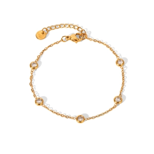 Close-up of gold chain bracelet with round-cut crystals and S925 engraved tag