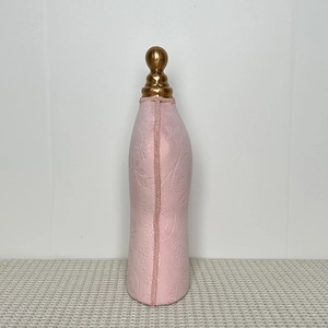Pink velvet mannequin stand with floral relief and golden finial for necklace display