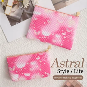 Quilted pink makeup bags set with butterfly and rainbow patterns in a lifestyle setting