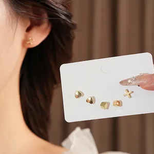Minimalist gold heart square cross stud earrings set with polished finish for women