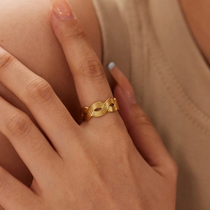 Minimalist 18K gold plated stainless steel wave ring with a woven multi-layer design