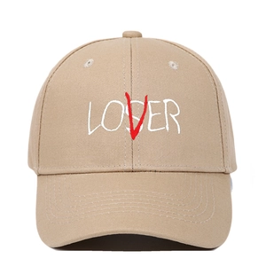 Detailed view of the LOSER to LOVER 3D embroidery on a khaki cotton baseball cap
