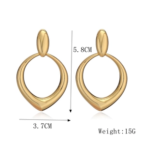 Macro shot of gold teardrop earrings with dimensions 5.8cm by 3.7cm and 15g weight