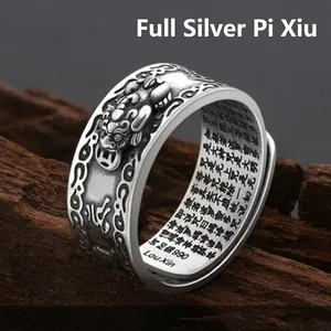 Bague vintage en argent 990 avec relief Pixiu et gravures de soutra du coeur