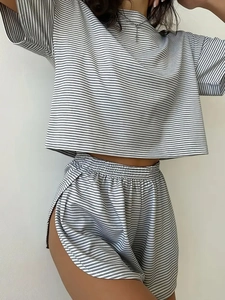 Detail showing the gray striped knit fabric and side slit design of the loungewear shorts