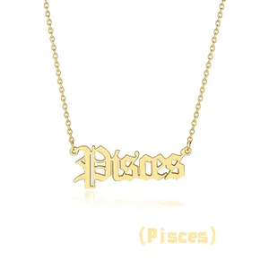Detail of gothic style Pisces pendant necklace in gold finish on a white background