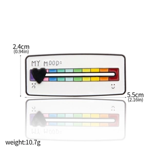 Detail view of rainbow mood enamel pin with slider and heart indicator showing dimensions