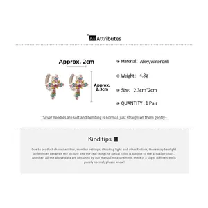 Size chart showing cross earrings dimensions 2.3cm height and 2cm width with alloy details