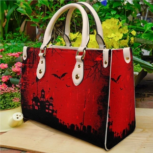Women's PU tote bag with Halloween haunted castle and bat print on a wooden shelf