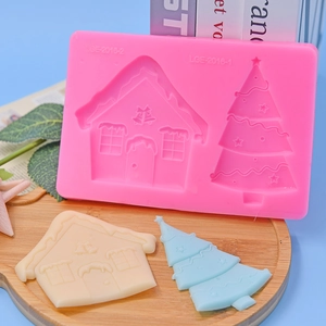 Pink silicone mold with Christmas tree and house shapes for DIY cake baking and crafts
