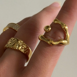 Set of 18k gold plated geometric hollow rings with organic fluid and hammered textures
