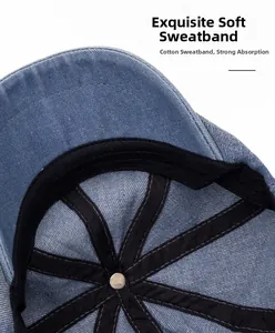 Detail of soft cotton sweatband and cross-stitching inside washed denim baker boy cap