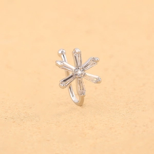 Detailed view of a silver snowflake nose cuff with rectangle cubic zirconia stones