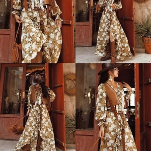 Bohemian floral dress with western belt, suede fringe vest and cowboy boots look