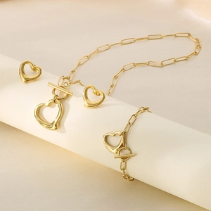 Three-piece gold titanium heart jewelry set with paperclip chain and T-bar toggle clasp