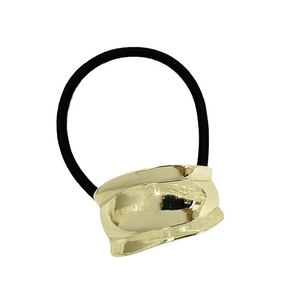 Sleek gold metal cuff hair tie with black elastic band shown on white background