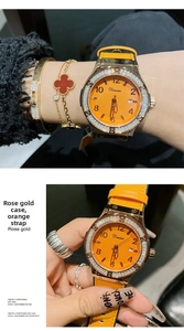Macro detail of rose gold watch case with sparkling diamonds and orange strap