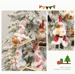 Close-up of Santa Claus hanging ornaments with sequins and faux fur details for Christmas