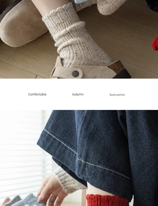 Detail of knitted wool socks with colorful speckles and rolled cuffs in cozy autumn style