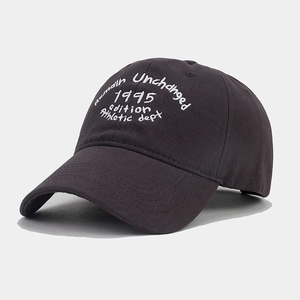 Detail of grey washed cotton baseball cap featuring white athletic department embroidery