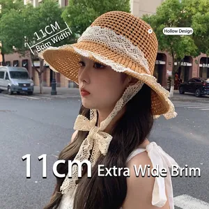 Summer hollow woven straw hat with white lace ribbon and 11cm wide sun protection brim