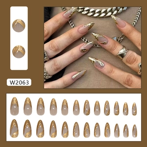 Press on nails with 24 pieces featuring gold sunset chrome flame design on long almond tips