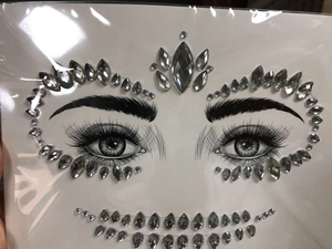 Detail of silver rhinestone face jewelry sticker for Halloween and masquerade makeup