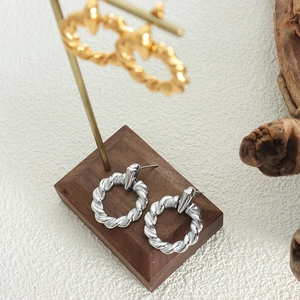 Minimalist silver twisted rope hoop earrings made of durable gold-plated titanium steel