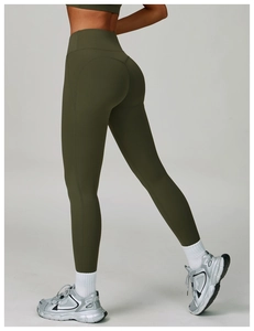 Side-back view of high-waisted olive green yoga pants with a butt-lifting design