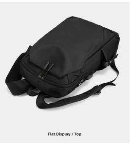 Detail view of black business backpack featuring tear-resistant nylon and USB charging port