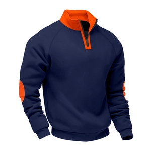Detail of color-block sweatshirt featuring 1/4 zipper collar and orange elbow patches